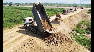 Dump trucks amp Powerful Bulldozer Working Constructing a new road foundation involves a coordinated [upl. by Leahcam480]