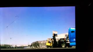 Flatbed Trucking Flying spread tarps over load quick securement of excess tarp [upl. by Jacklyn]