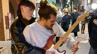 Street performer surprised by guitarist passing by in Korea [upl. by Llenoj884]