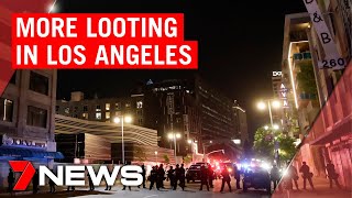 American riots Protesters leave but looting continues in Los Angeles  7NEWS [upl. by Materi]