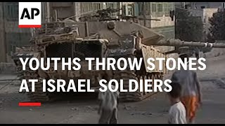 Youths throw stones at Israel soldiers [upl. by Ahsekim]