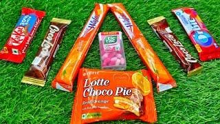 Satisfying video asmr unpacking candy lollipop chocolate asmr 🍊Orange Chocolate Lotte Choco pie cake [upl. by Bullion]