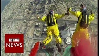 Record breaking base jump from worlds tallest building  BBC News [upl. by Asillem]