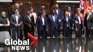 G7 summit World leaders pose for quotfamily photoquot in courtyard of Schloss Elmau Castle [upl. by Kameko589]