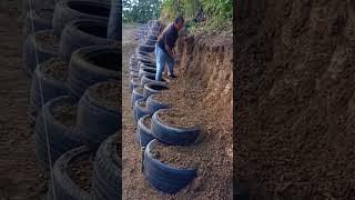 Slope protection building process with tires [upl. by Ettevahs931]