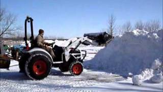 Bobcat tractor moving snow [upl. by Ubald]