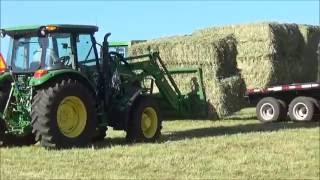 Loading And Hauling Large Square Bales With A John Deere 5085M amp 6300 [upl. by Nyvrem]