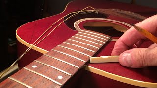 How to lower the action on an acoustic guitar [upl. by Gabriele]