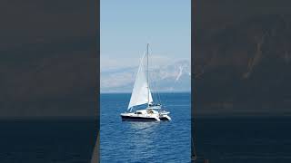 catamaranyachtsailinginopenblueseacoastline automobile [upl. by Cerelly]