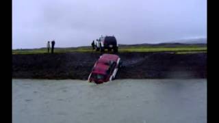 Nissan Patrol y61 bigfoot crossing a glacial river in Iceland [upl. by Pittel]