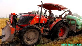 Incredible Power Tractor Kubota M6040SU And Kubota MU5702 Heavy Loading Rice Across The Mud [upl. by Bortz]