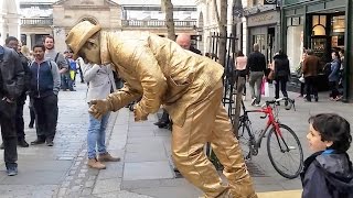 Golden man London street performer floating and levitating trick Covent Gardens [upl. by Edson338]