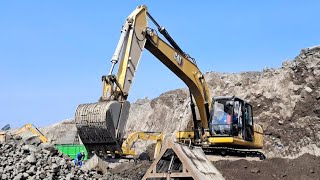 Caterpillar excavator works loading sand into a dump truck  4k [upl. by Cristie]