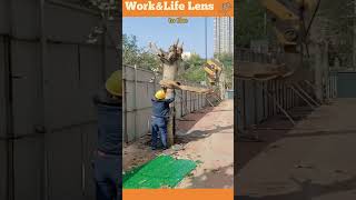 Hydraulic crane with winch extracts tree trunk using secure rigging for safe lifting [upl. by Wandis]