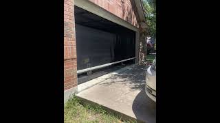 A garage workshop outfitted with our motorized shade in Austin TX garagemakeover austin [upl. by Aehtorod]