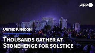 Thousands gather at Stonehenge to celebrate summer solstice  AFP [upl. by Yelyak41]