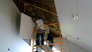 Hanging 4x12 sheetrock on a 25 ceiling [upl. by Osborn982]