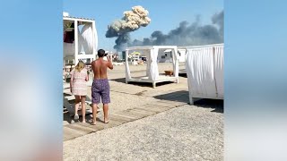 Crimea beachgoers run after airfield explosion [upl. by Nelo]