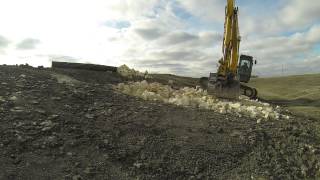 Applying rip rap for a culvert outfall [upl. by Kristopher]