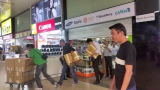 Plainclothes police investigators leaving Sim Lim Sqaures Mobile Air with boxes [upl. by Ternan]