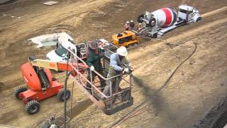 Shotcrete Wall  cutting earth then spraying concrete to create usable landREED C50HP [upl. by Hailee]