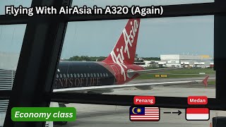 Flying With AirAsia in Airbus A320200  Economy Class  Penang  Medan [upl. by Agata]