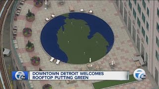 Dowtown Detroit welcomes rooftop putting green [upl. by Brezin]