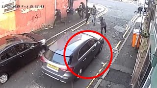 Surveillance Camera Footage Captures Gang Driveby Shooting In Manchester England [upl. by Irwinn851]