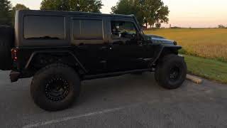 2013  4Door Jeep Wrangler Lifted with monster tires [upl. by Salamanca]