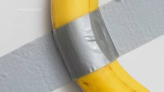 Ducttaped banana sells for 62 million at art auction [upl. by Crist]