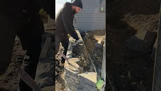 Completing a Blue Stone retaining wall canberra stonemason masonry landscaping [upl. by Aihsoem]