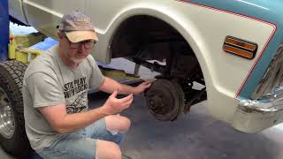 Greasing the wheel bearings and lubing brake parts on a 1971 GMC pickup truck [upl. by Elspeth368]