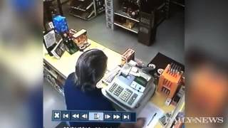 Robber pulls gun liquor store clerk is faster [upl. by Berton938]