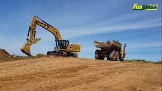 CAT 336 Excavator Loading Stone Into Dump Truck CAT 730 C [upl. by Charteris]