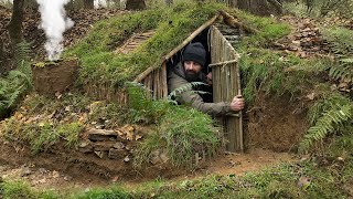 Building complete and warm survival shelter  Bushcraft earth hut grass roof amp fireplace with clay [upl. by Namyh]