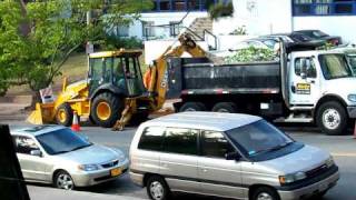 John Deere backhoeloader with rotating bucket [upl. by Kazim]