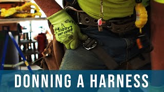 How to Put on a Fall Protection Harness  Safety Hazards Training Oregon OSHA [upl. by Tawnya987]