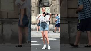 A beautiful violinist performing on a street of Warsaw Old Town Poland [upl. by Jobe]