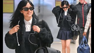 Jenna Ortega puts on a leggy display in a navy pleated mini dress and fluffy bomber jacket [upl. by Elias]