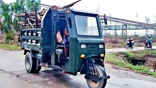 Threewheeled tractor with 30cc engine carrying wood in the factory [upl. by Marijn]