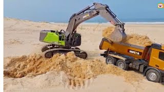 Sand excavatoron the beachCranetractorambulancescontainerexcavatortractors L25961 [upl. by Etteneg]