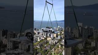 1957 Porsche Speedster gets lifted up 58 stories to a soon to be completed penthouse in Vancouver [upl. by Ynaffets302]