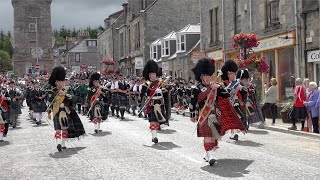 Chieftain leads the massed pipe bands parade through Dufftown to the 2022 Dufftown Highland Games [upl. by Akenaj433]