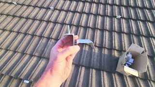 Installing solar panels on a Harvey tile roof [upl. by Emiolhs]