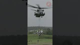 The US Marines use a CH53E Super Stallion to perform a lift on an AV8B Harrier II no1trending [upl. by Wadell]