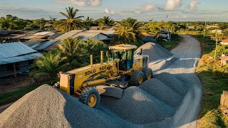 A large SDLG motor grader is pushing gravel for construction road building foundation projects [upl. by Leunamnauj505]