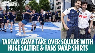 Tartan Army play football on huge Saltire and fans swap shirts in Cologne [upl. by Compton975]