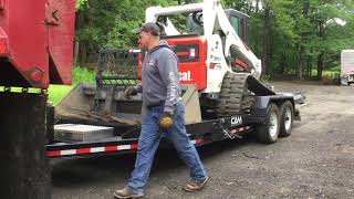 Loading a T770 Bobcat Bucket Forksand Mower [upl. by Audette142]