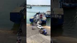 A woman pushes a tricycle full of winter melons off the boat and onto the ferry to cross the riv [upl. by Llevart690]