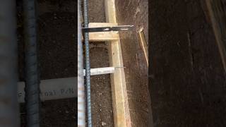 Setting up for weep holes in a little retaining wall forming framing concrete tradesmen [upl. by Ansela]